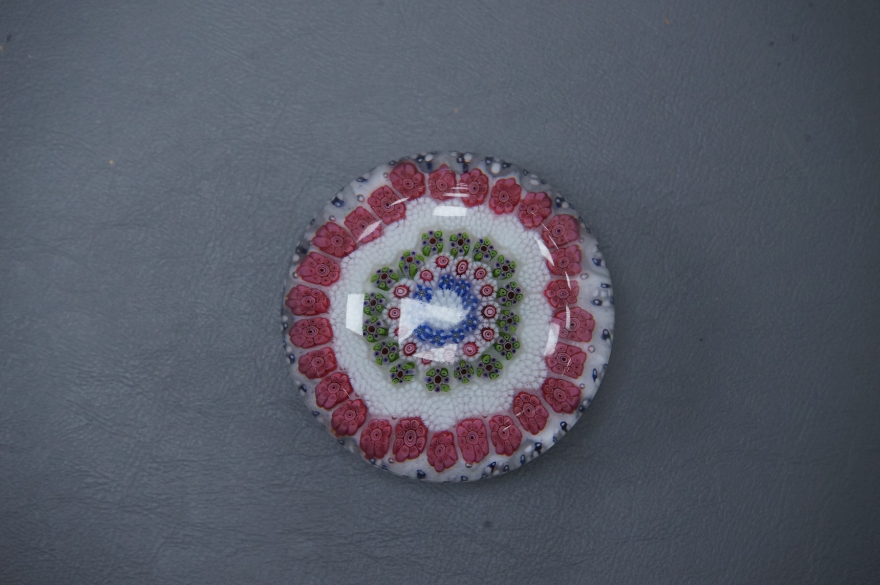 A Clichy concentric millefiori paperweight, green and white - striped basket, 7.5cm wide